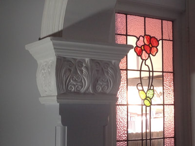 Moulded plaster decorations look best painted white - flat or low sheen.